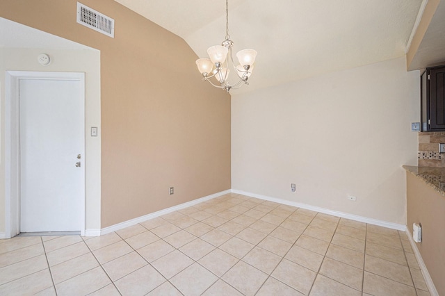 13930 Bonnercrest Dr, Houston, TX 77083 - unfurnished dining area with a chandelier, vaulted ceiling, light tile patterned floors, and baseboards