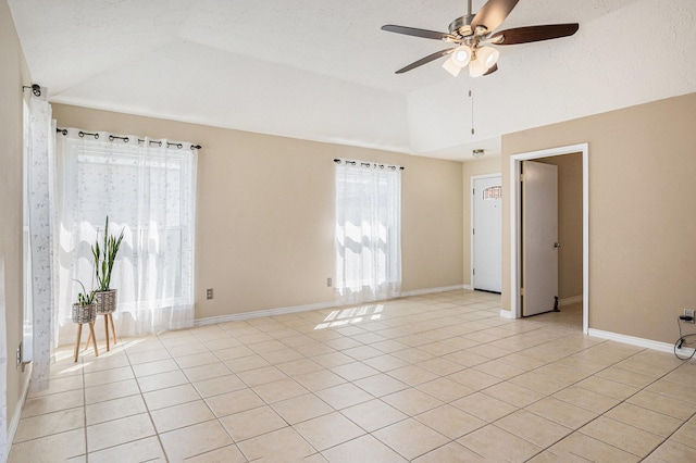 13930 Bonnercrest Dr, Houston, TX 77083 - spare room featuring ceiling fan, light tile patterned floors, vaulted ceiling, and baseboards