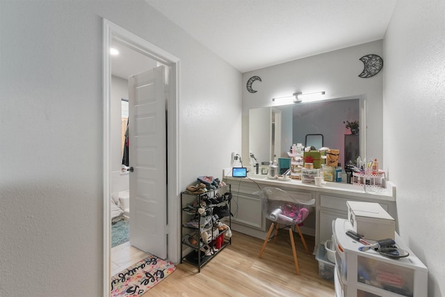 bathroom with vanity and wood finished floors