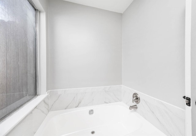 bathroom with a garden tub
