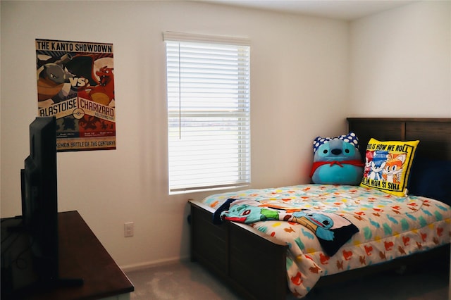 bedroom with baseboards and carpet floors