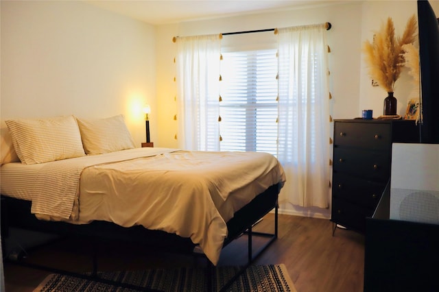 bedroom featuring wood finished floors