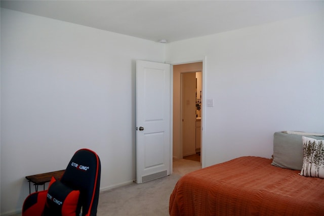 bedroom with light colored carpet