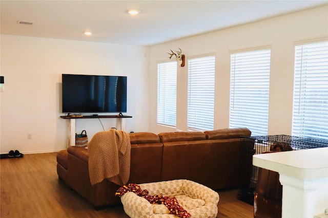 living room with recessed lighting, wood finished floors, and baseboards