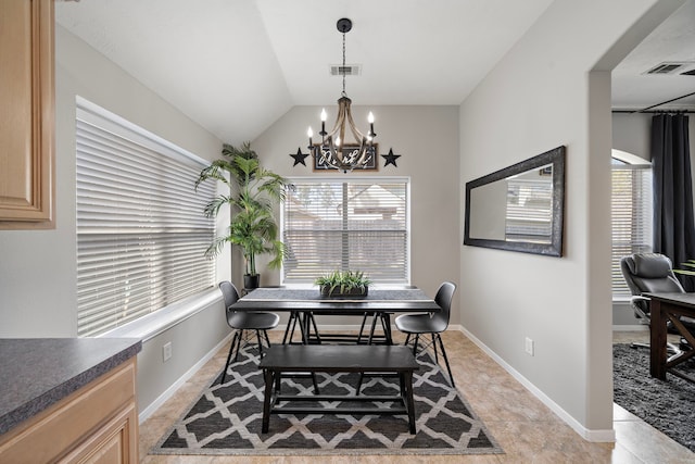 dining area with visible vents, plenty of natural light, and vaulted ceiling