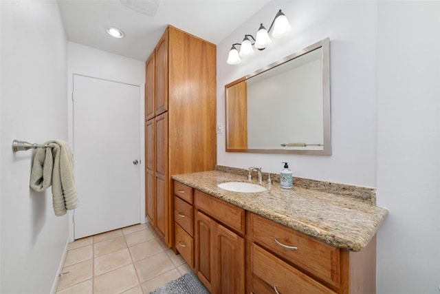 bathroom with tile patterned flooring and vanity