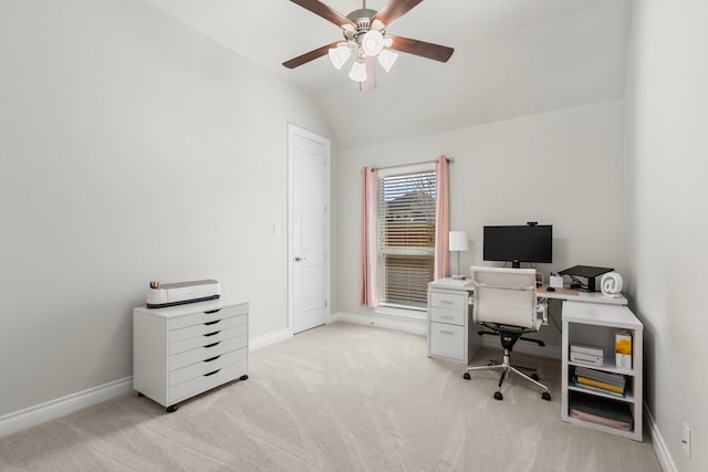 office featuring baseboards, light colored carpet, a ceiling fan, and vaulted ceiling