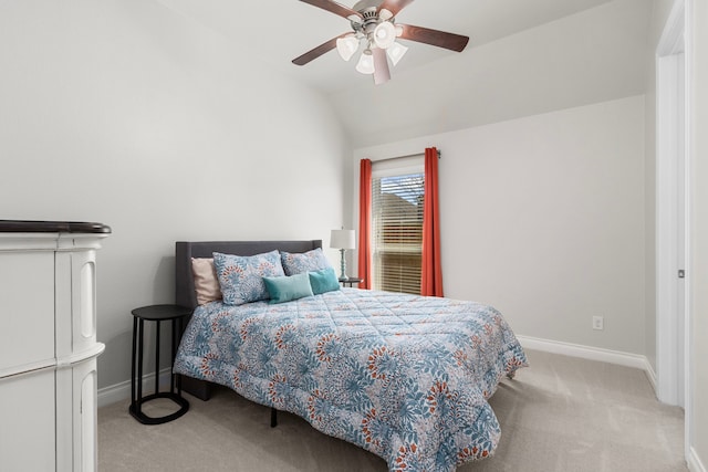 bedroom with ceiling fan, lofted ceiling, baseboards, and light carpet