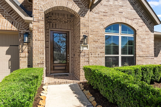 property entrance with brick siding