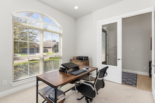 home office featuring recessed lighting, french doors, baseboards, and light carpet