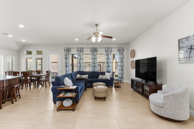 living room featuring recessed lighting, baseboards, ceiling fan, and vaulted ceiling