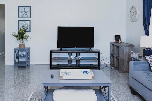 living room featuring baseboards