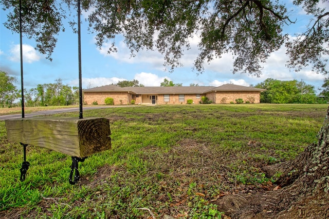 single story home with a front yard