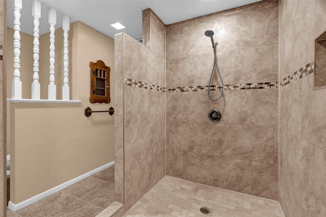 full bath with baseboards and walk in shower