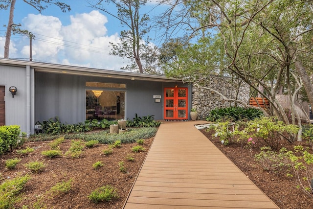 view of exterior entry featuring french doors