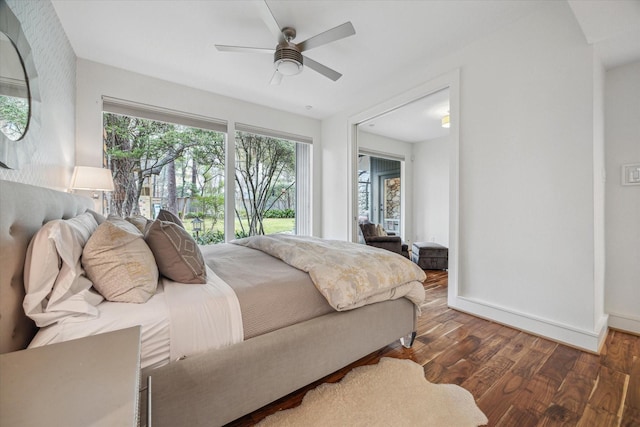 bedroom featuring baseboards, a ceiling fan, and wood finished floors