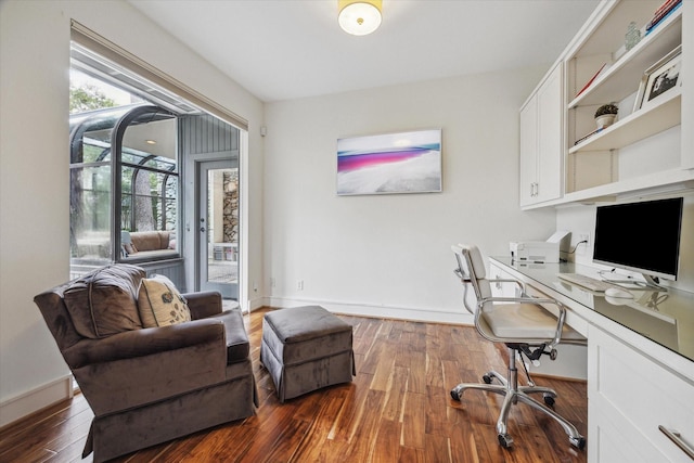 office area featuring baseboards and wood finished floors