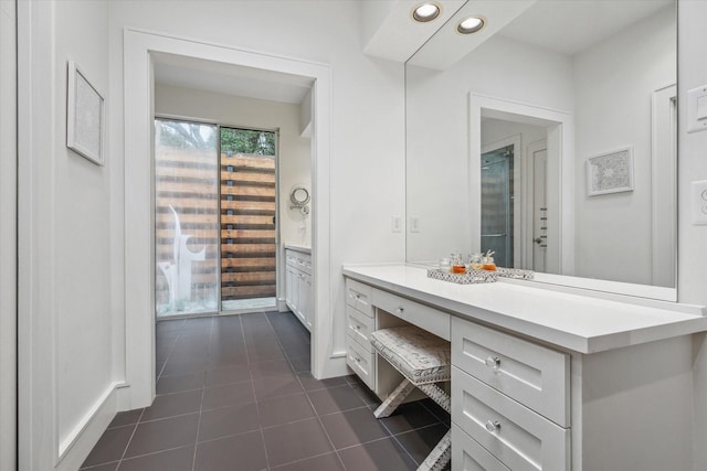 bathroom featuring vanity, recessed lighting, and tile patterned flooring