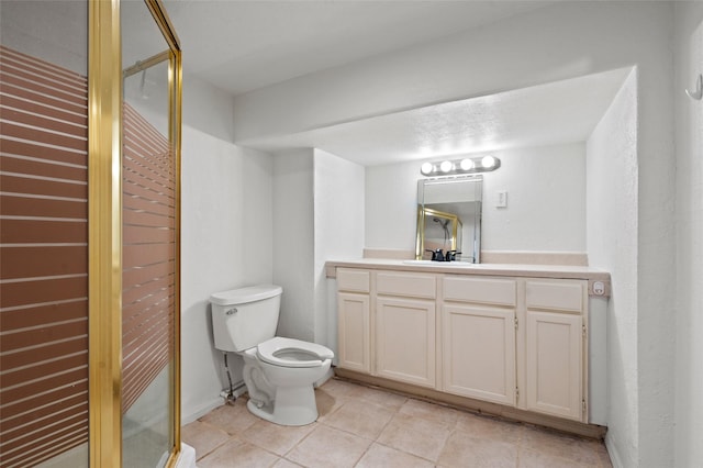 full bath with vanity, tile patterned floors, toilet, and a shower stall