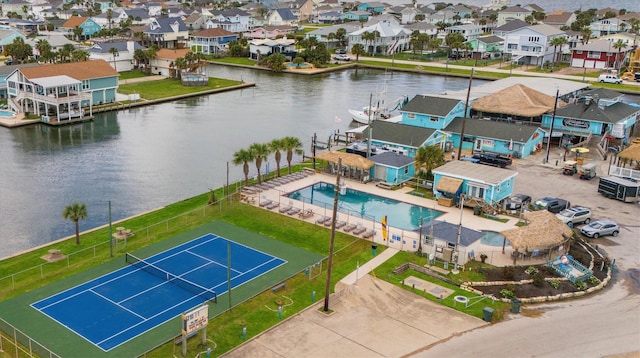 drone / aerial view featuring a residential view and a water view