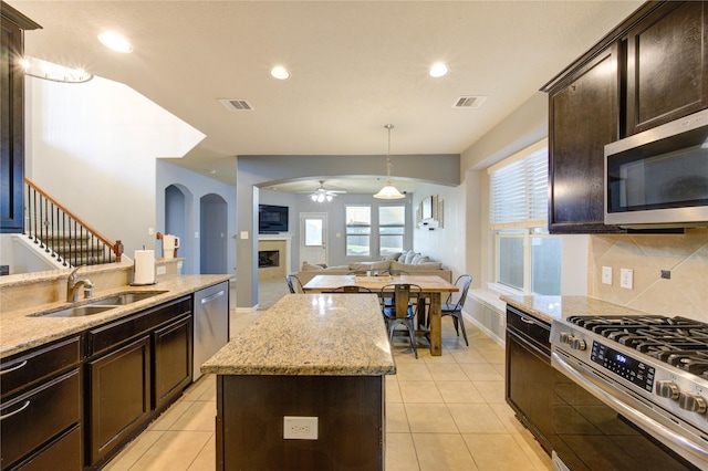 kitchen featuring a ceiling fan, visible vents, appliances with stainless steel finishes, and a sink