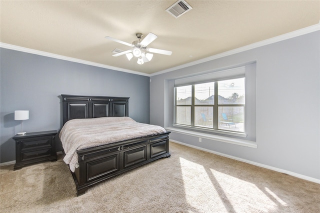 bedroom with visible vents, crown molding, and baseboards