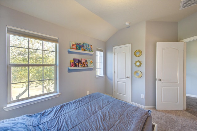 bedroom featuring visible vents, baseboards, lofted ceiling, and carpet flooring