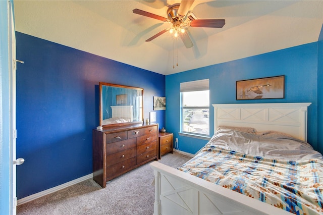 carpeted bedroom featuring a ceiling fan and baseboards