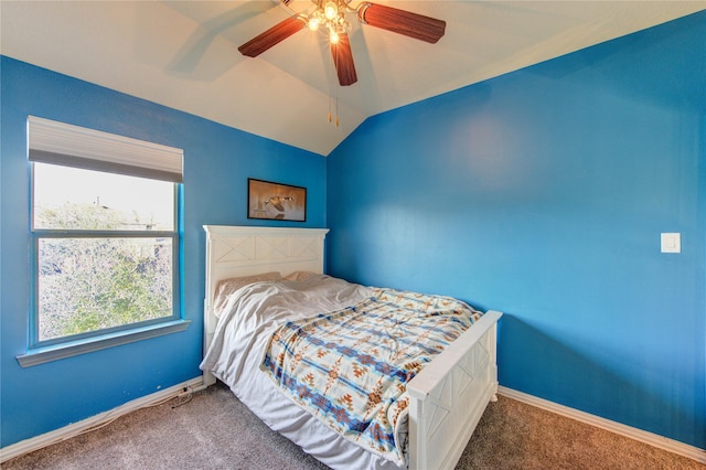 carpeted bedroom featuring lofted ceiling, a ceiling fan, and baseboards