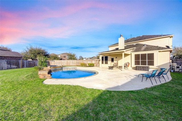 view of pool featuring a fenced in pool, a lawn, a fenced backyard, and a patio area