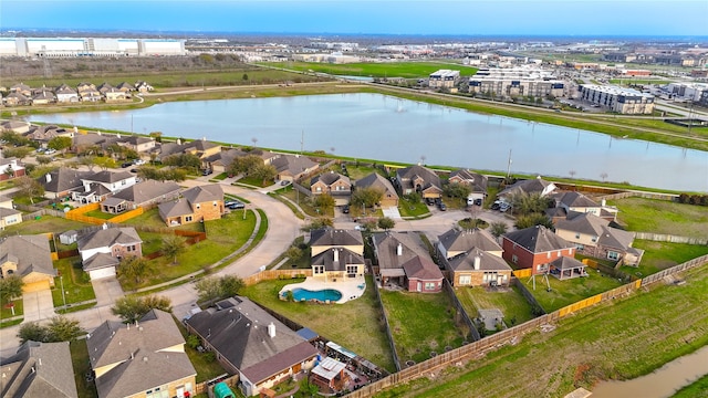 drone / aerial view with a residential view and a water view