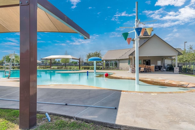 pool featuring a patio area and fence