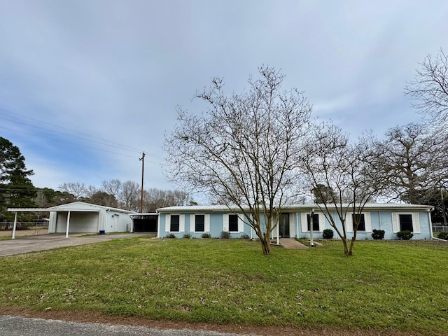 view of front of house with a front yard and a carport