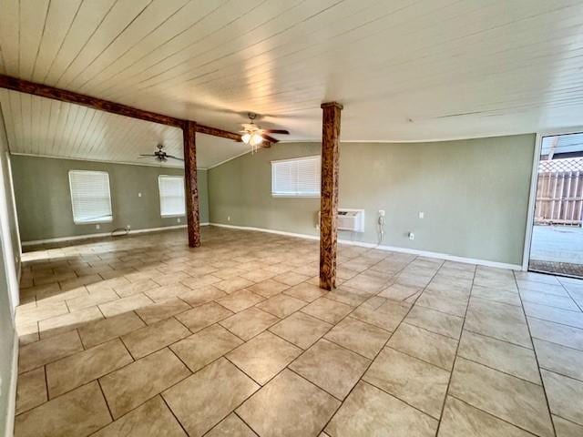 unfurnished room featuring light tile patterned floors, baseboards, a ceiling fan, and ornate columns