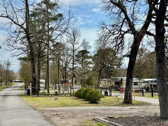 surrounding community featuring a gate and a fenced front yard