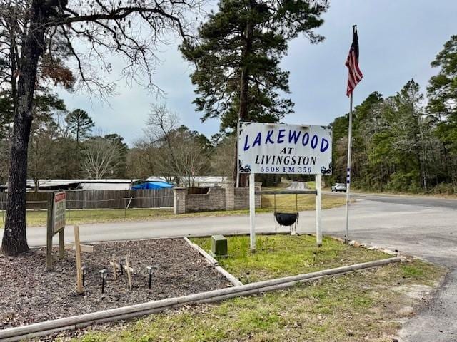 community sign with fence