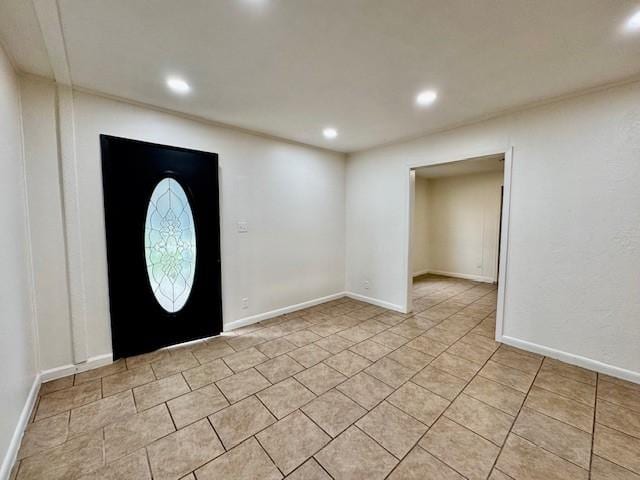 entryway with recessed lighting, baseboards, and light tile patterned flooring