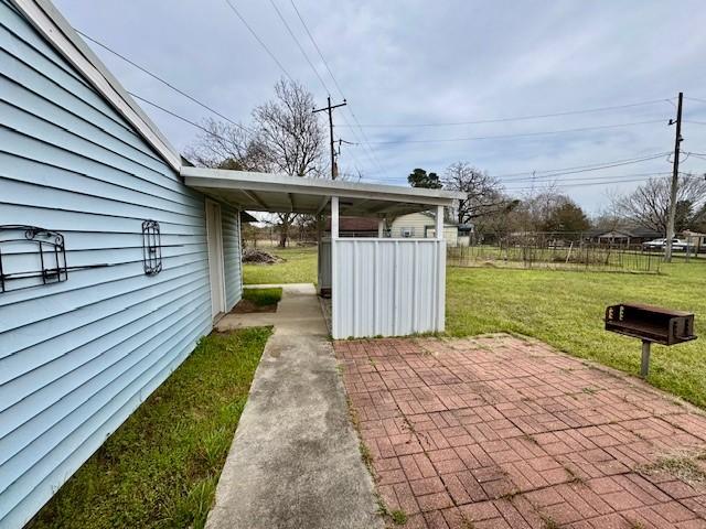 view of patio / terrace featuring fence