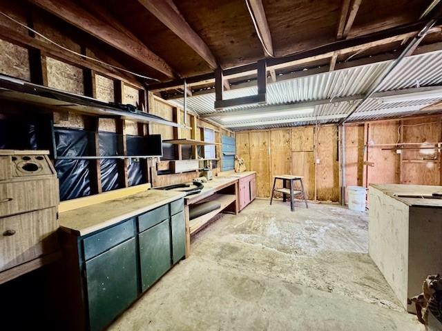 interior space featuring a workshop area and concrete flooring