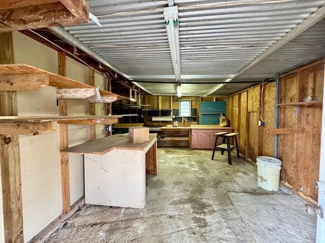 miscellaneous room featuring unfinished concrete flooring