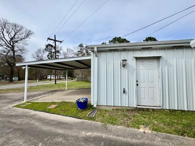 view of outbuilding with a carport