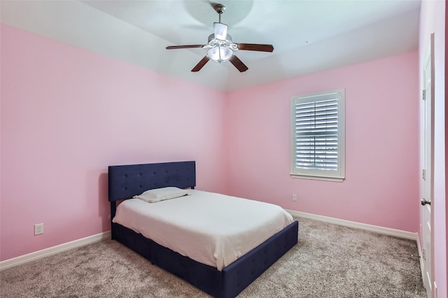 carpeted bedroom with baseboards and ceiling fan