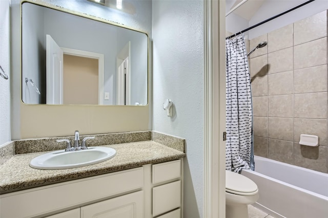 full bath with shower / bath combo with shower curtain, toilet, vanity, and a textured wall