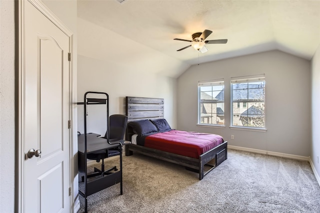 bedroom with lofted ceiling, carpet flooring, a ceiling fan, and baseboards