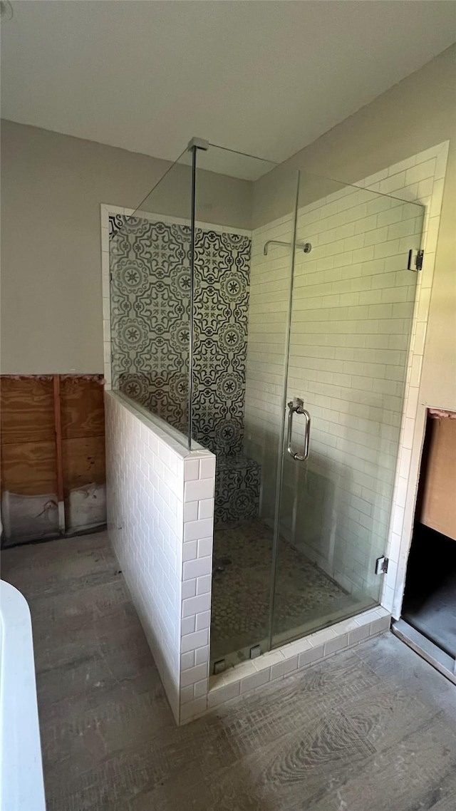 full bathroom featuring a shower stall