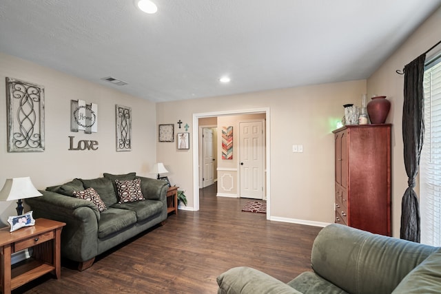 living room with visible vents, recessed lighting, baseboards, and wood finished floors