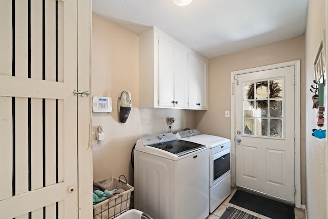 laundry area featuring cabinet space and washing machine and dryer