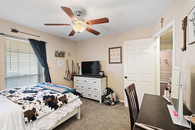 carpeted bedroom with baseboards and ceiling fan