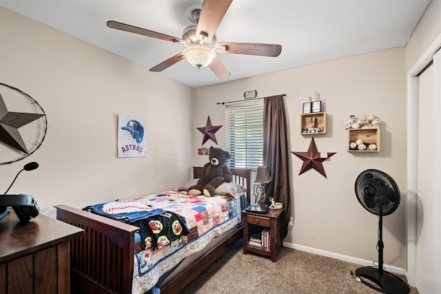 bedroom featuring light colored carpet, baseboards, and ceiling fan