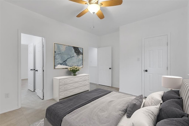 bedroom featuring a ceiling fan and baseboards